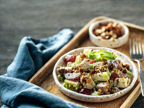 Waldorf salad on black, copy space, top view