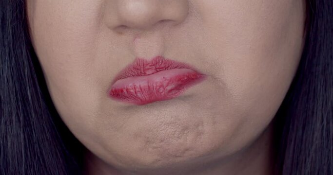 Close up female face with turn up mouth with disgust
