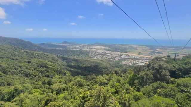 Skyrail Cableway Gondolas Going Over Barron Gorge Rainforest. Follow Shot