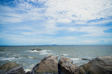 Waves on the seaside rocks are splashing on the rocks