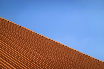 Brown metal steel plate for background. Blue sky background.