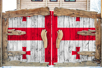 Close-up of the national flag of Georgia on a wooden gate at the entrance to the closed territory. The concept of storage of goods, entry to a closed area.