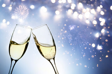 Two glasses of champagne in new year fireworks