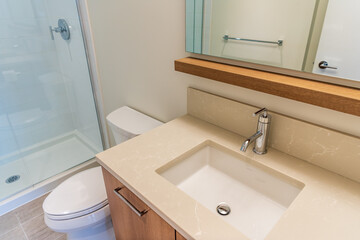 Fragment of an empty bright, clean bathroom in a luxury house.