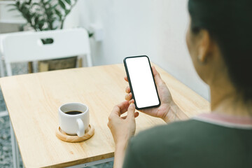 cell phone blank white screen mockup.woman hand holding texting using mobile on desk at office.background empty space for advertise.work people contact marketing business,technology