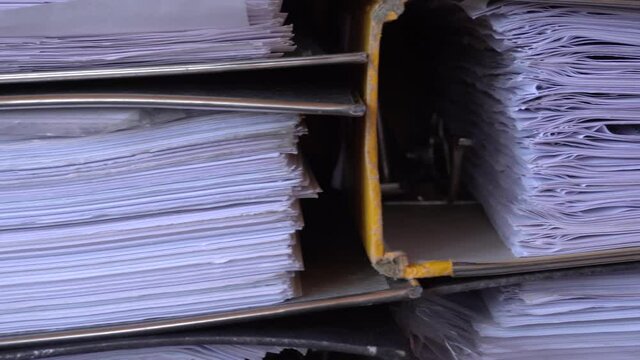 4K closeup video of papers and files in archives of business financial documents