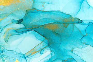 Chaotically splattered blue transparent ink stains. Abstract watercolor background with gold splashes.