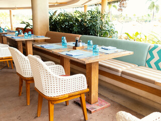 Restaurant interior design in blue and white colors . Wooden furniture.