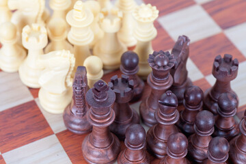 Densely packed chess pieces on the chessboard