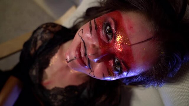 madness and art creativity of young makeup artist woman, portrait of lady with face-art