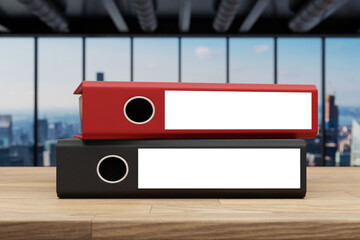 stack of red and black office binder file folder on wooden desk in large modern office building with skyline view; white label; 3D Illustration