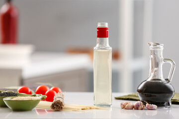 Composition with rice vinegar  on table