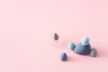 Makeup sponges on color background