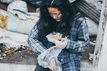 poor people,homeless or beggar begging for help sitting at dirty slum.concept for poverty...