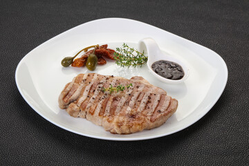 Grilled pork steak with pepper sauce