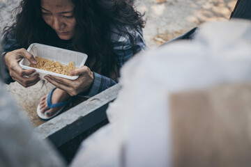 poor people,homeless or beggar begging for help sitting at dirty slum.concept for poverty...
