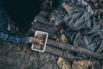 poor people,homeless or beggar begging for help sitting at dirty slum.concept for poverty...