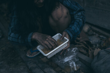 poor people,homeless or beggar begging for help sitting at dirty slum.concept for poverty...