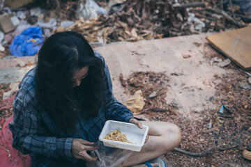 poor people,homeless or beggar begging for help sitting at dirty slum.concept for poverty...