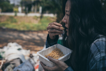 poor people,homeless or beggar begging for help sitting at dirty slum.concept for poverty...