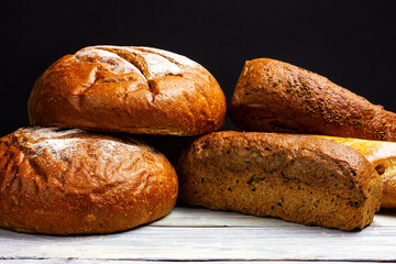 Rye bread on a light wooden table. Fresh crispy bread.