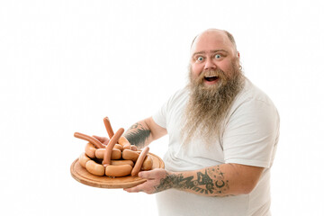Emotional fat funny and tattooed man with food isolated on a white background