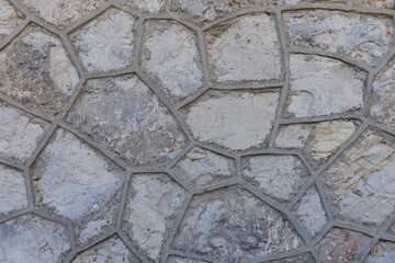 Abstract stone wall background, stone wall looks like honeycomb, rough surface and space for text