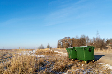 garbage containers in the open field, the concept of environmental protection