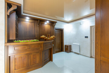 Reception area interior with brown wooden reception desk