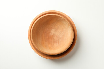 Two wooden bowls on white background, top view