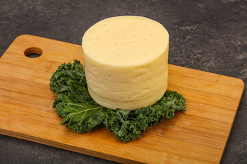 Yellow round dairy soft cheese