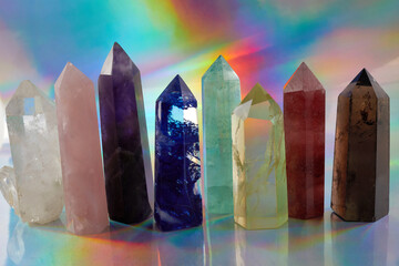 Healing Chakra crystals on halographic background. Meditation, Reiki or spiritual healing...