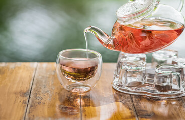 Tea is a healthy drink.  Afternoon  pink carnation tea with a glass. 