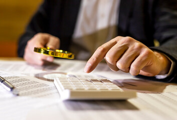 Analysing of accounting and financial documents, diagrams with magnifier and calculator. economy research