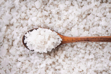 Authentic Sea salt on wooden spoon. for garnish or spa aromatherapy. Raw food for health concept.