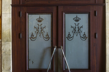 glass door engraved with coat of arms inside the church of Valega district of Aveiro, Portugal