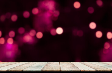 Bokeh for happy new year 2021 concept. Blank wood table on blur abstract pink bokeh for background.