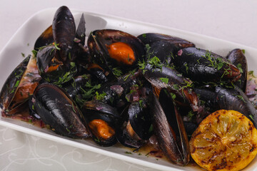 Tasty delicous boiled Mussels with herbs