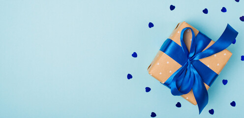 Horizontal wide photo picture of nice cute beautiful present box wrapped in kraft paper and bow...
