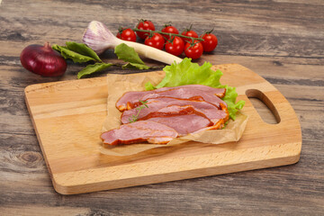 Sliced smoked duck breast served salad