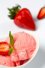 Strawberry ice-cream and strawberry in studio