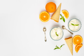 Ice-cream and orange in studio