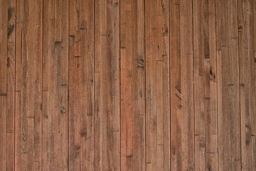 Fototapeta premium Background from narrow vertically arranged wooden planks with copy space. Wood texture.