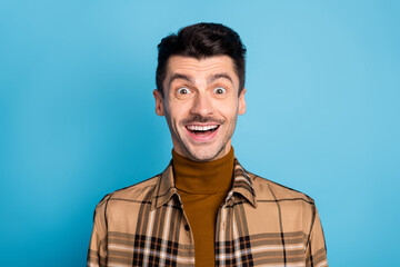 Obraz premium Portrait of young happy positive excited crazy shocked amazed man see big sale isolated on blue color background
