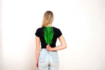 Green fern on female back,spine and female health concept