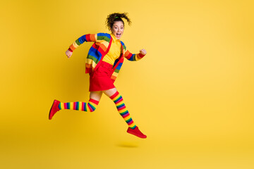 Fototapeta na wymiar Full size profile side photo of crazy funky girl jump run wear rainbow skirt long socks isolated bright color background