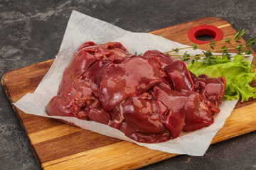 Raw chicken liver over board