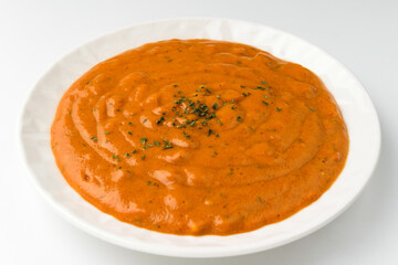 Curry with spices on a white background