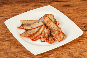 Roasted juicy bacon in the plate