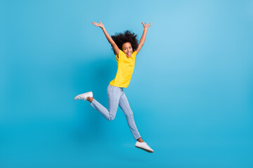 Full body profile side photo afro american volume hair girl wear jeans yellow t-shirt raise hands...
